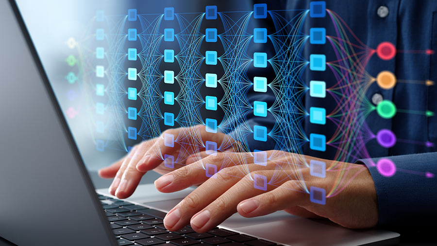 Photo of a person using a laptop with overlaying machine learning model